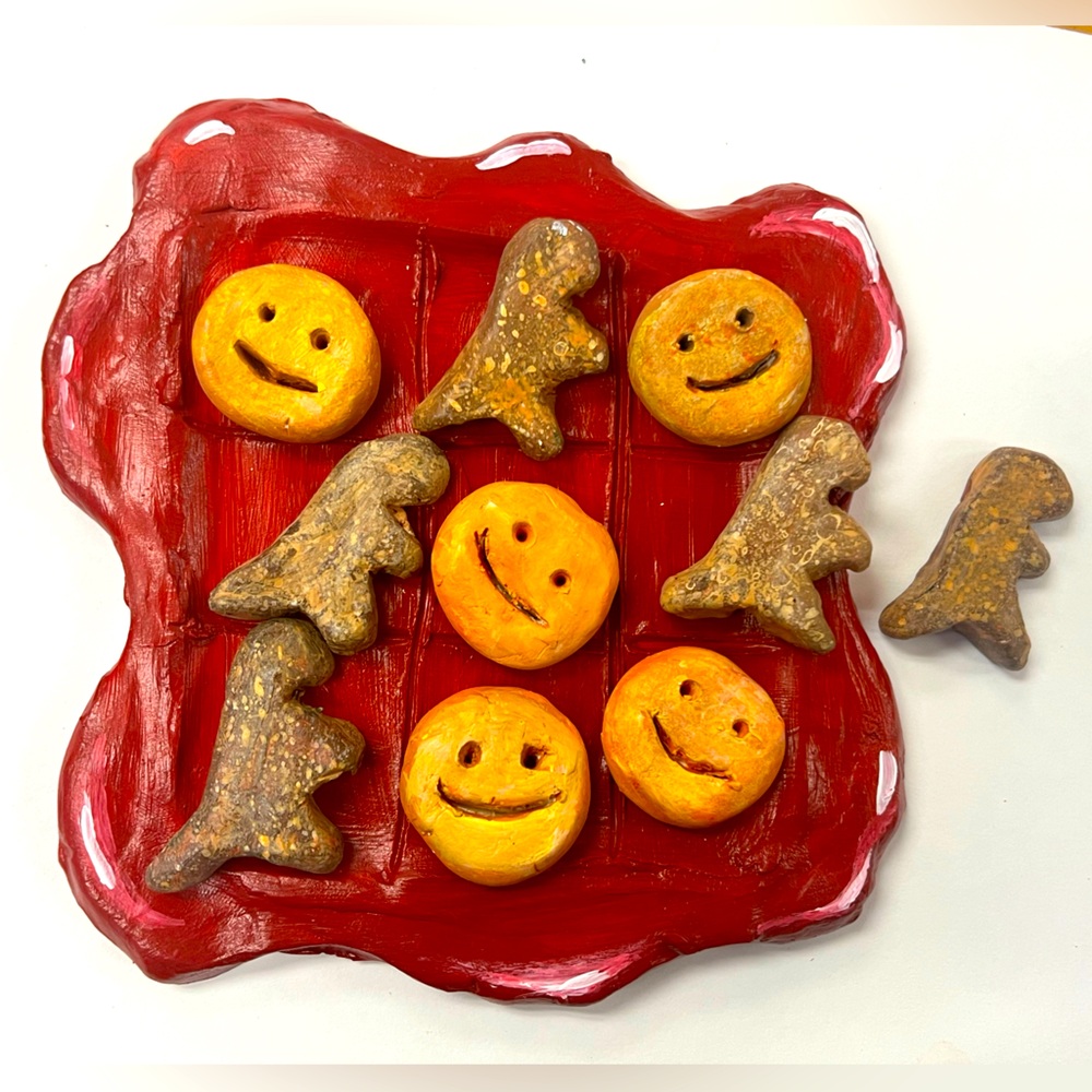 Dino Nugget and Smiley Fries tic-tac-toe board